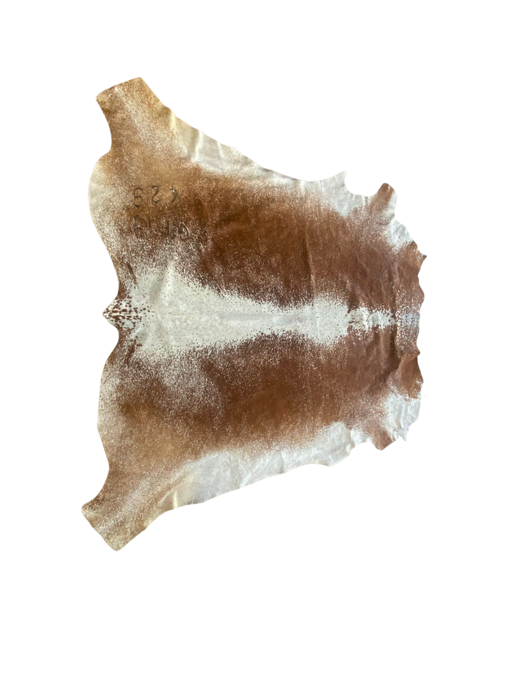Hides of brown and white cowhide