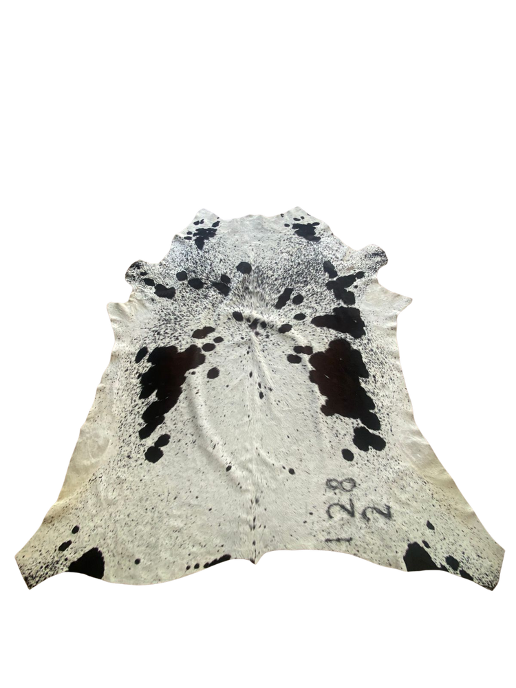 Cowhide rug with black and white pattern on a white background