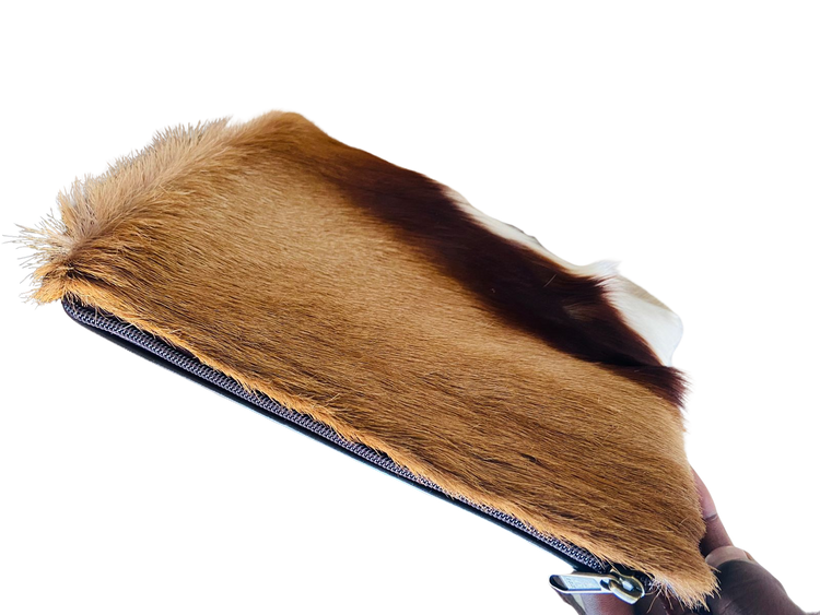 Fur-covered product with a zipper on a white background