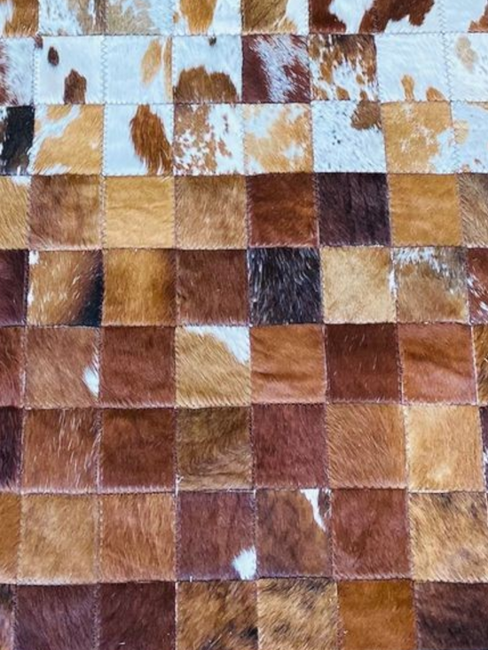 Checkered pattern of brown, beige, and white squares