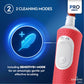 Red electric toothbrush with cleaning mode features on a blue background