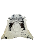 Cowhide rug with black and white pattern on a white background