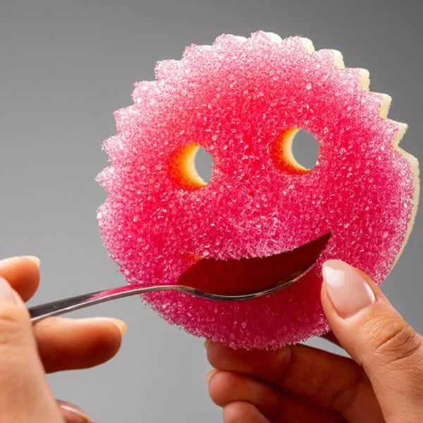 Scrub Mommy pink sponge showing soft ResoFoam reverse side
