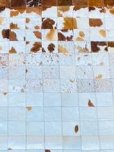 Close-up of a quilt with brown and white pattern